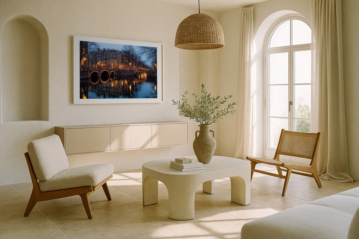 Amsterdam Canal at Night wall art print, framed with a white border, in a sunlit cream lounge