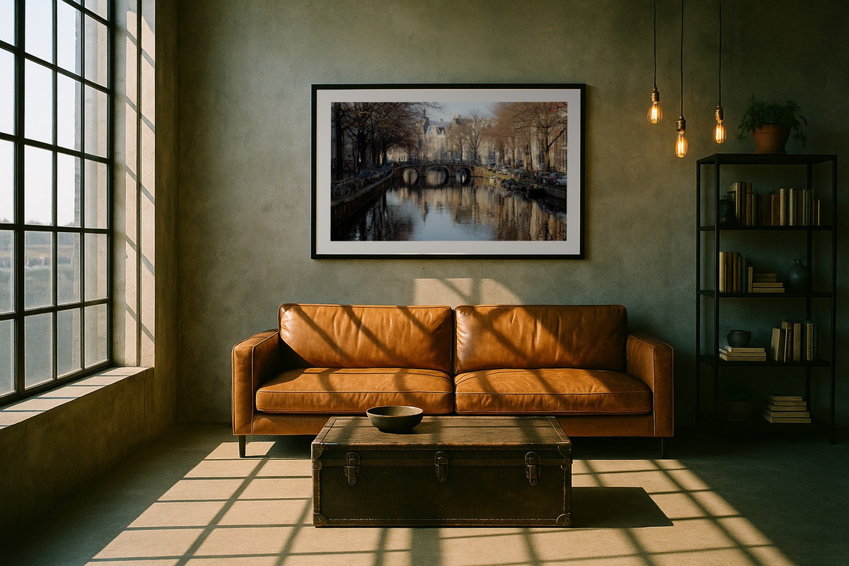 Amsterdam Canal Bridge II wall art print, framed with a white border, in a loft leather sofa