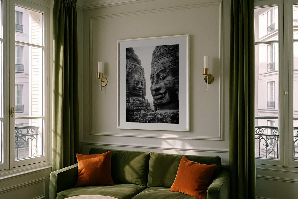 Bayon Faces wall art print, framed with a white border, in a concrete black frame