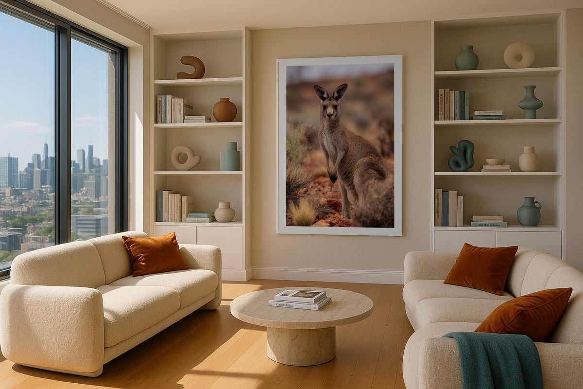 Outback Kangaroo wall art print, framed with a white border, in a cream sofa plants