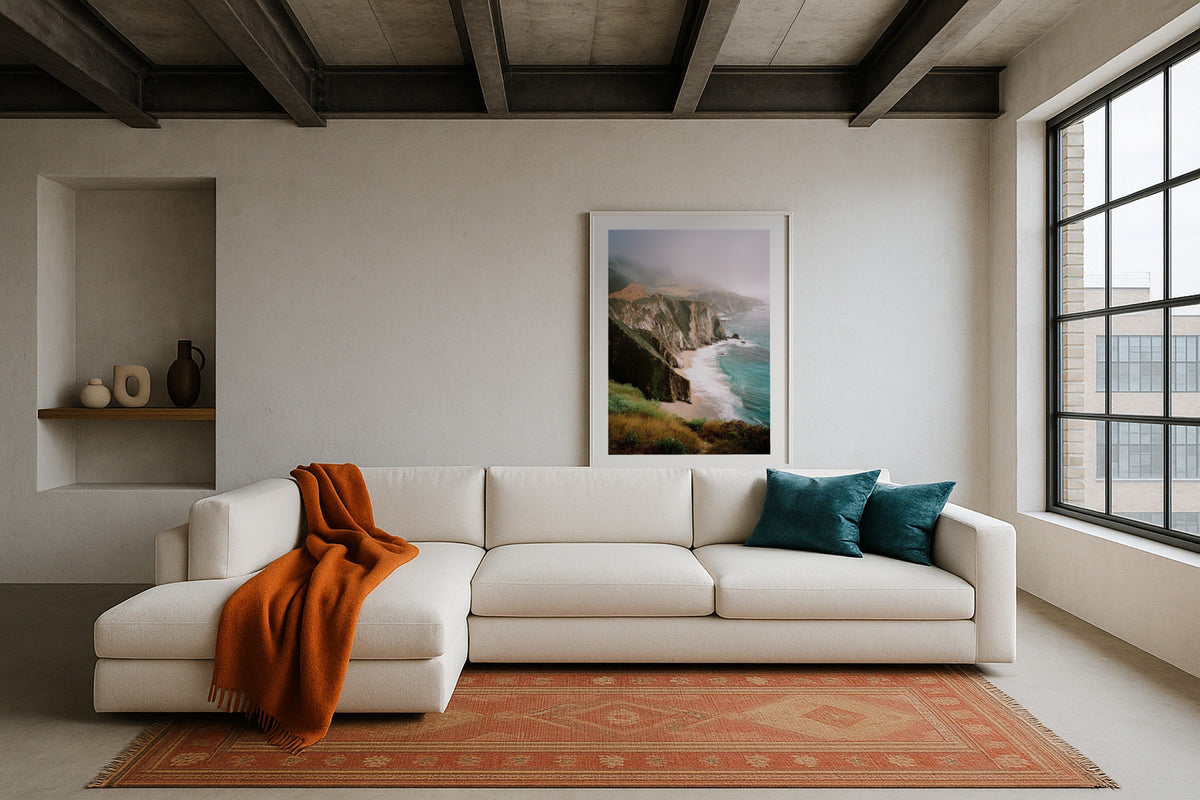 Bixby Bridge wall art print, framed with a white border, in a sea view loft