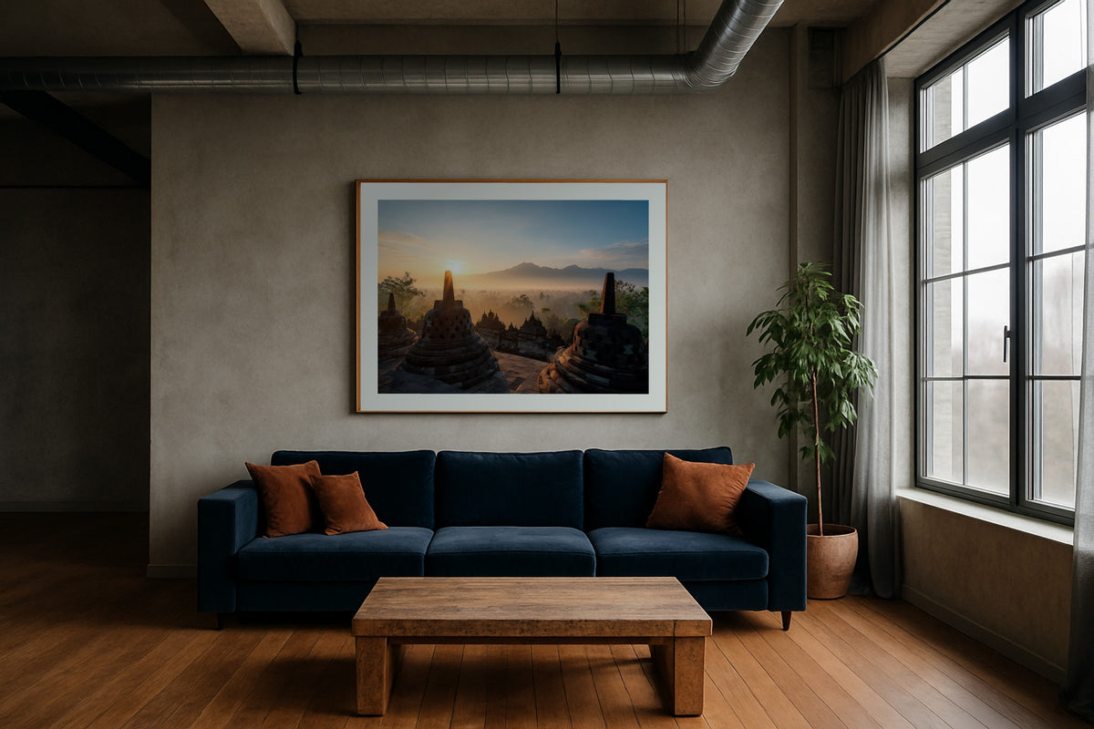 Borobudur at Sunrise wall art print, framed with a white border, in a hotel bedroom tulips