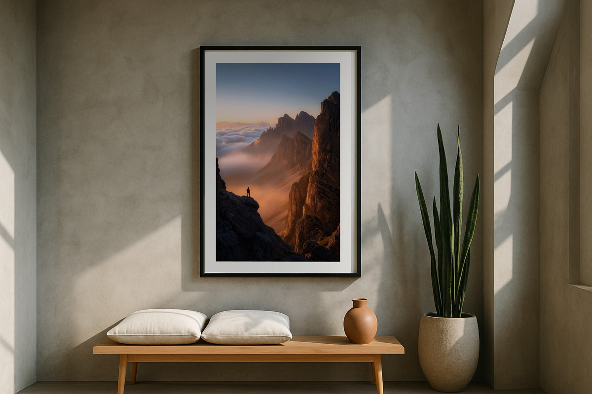 Hiker Above the Clouds wall art print, framed with a white border, in a olive sofa garden doors