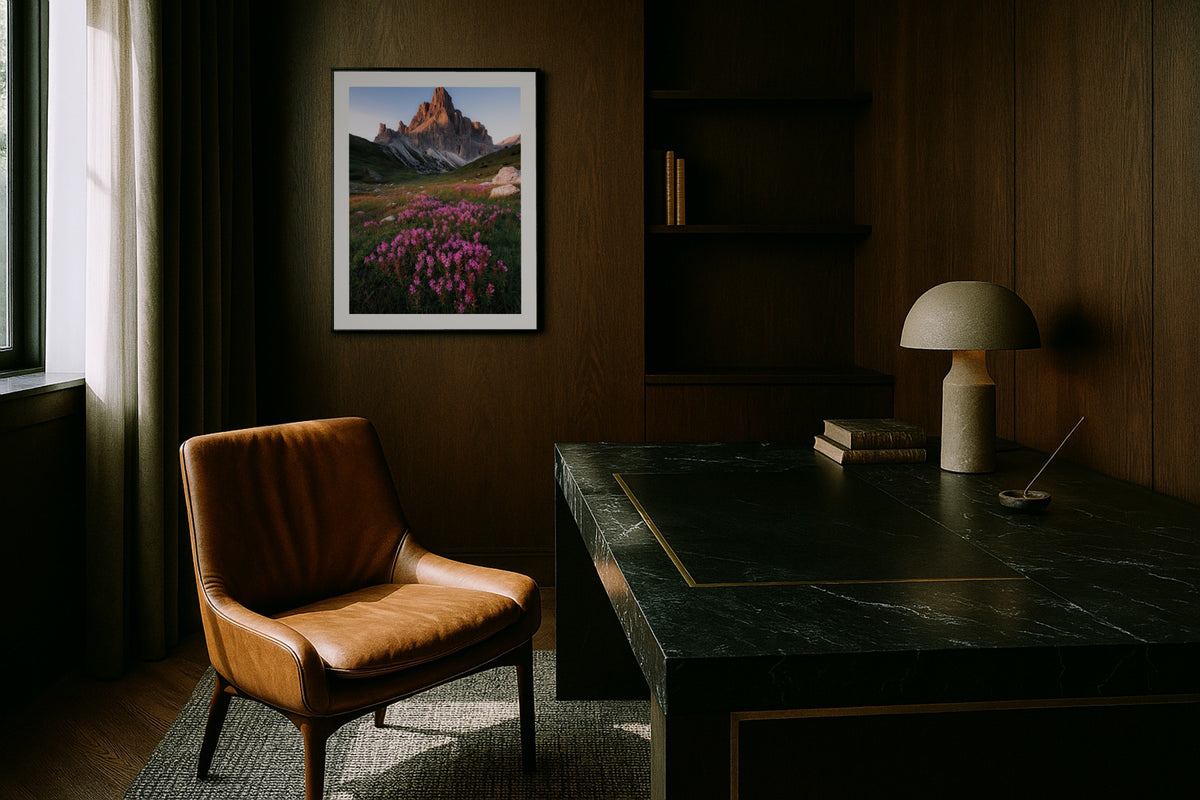 Passo di Giau wall art print, framed with a white border, in a dark wood office leather chair