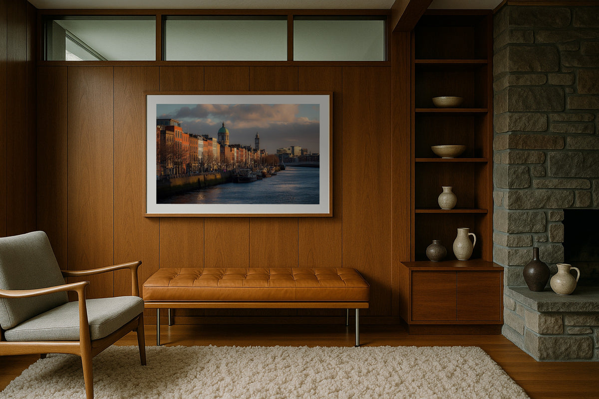 The River Liffey wall art print, framed with a white border, in a midcentury stone fireplace