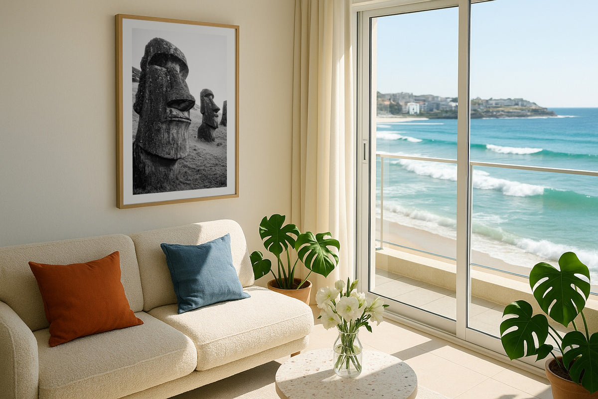 Moai in Black & White wall art print, framed with a white border, in a Bondi beach balcony