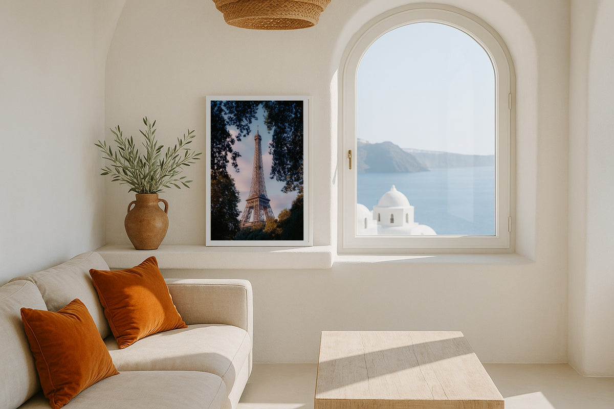 Eiffel Tower Through Trees wall art print, framed with a white border, in a NYC teal sofa