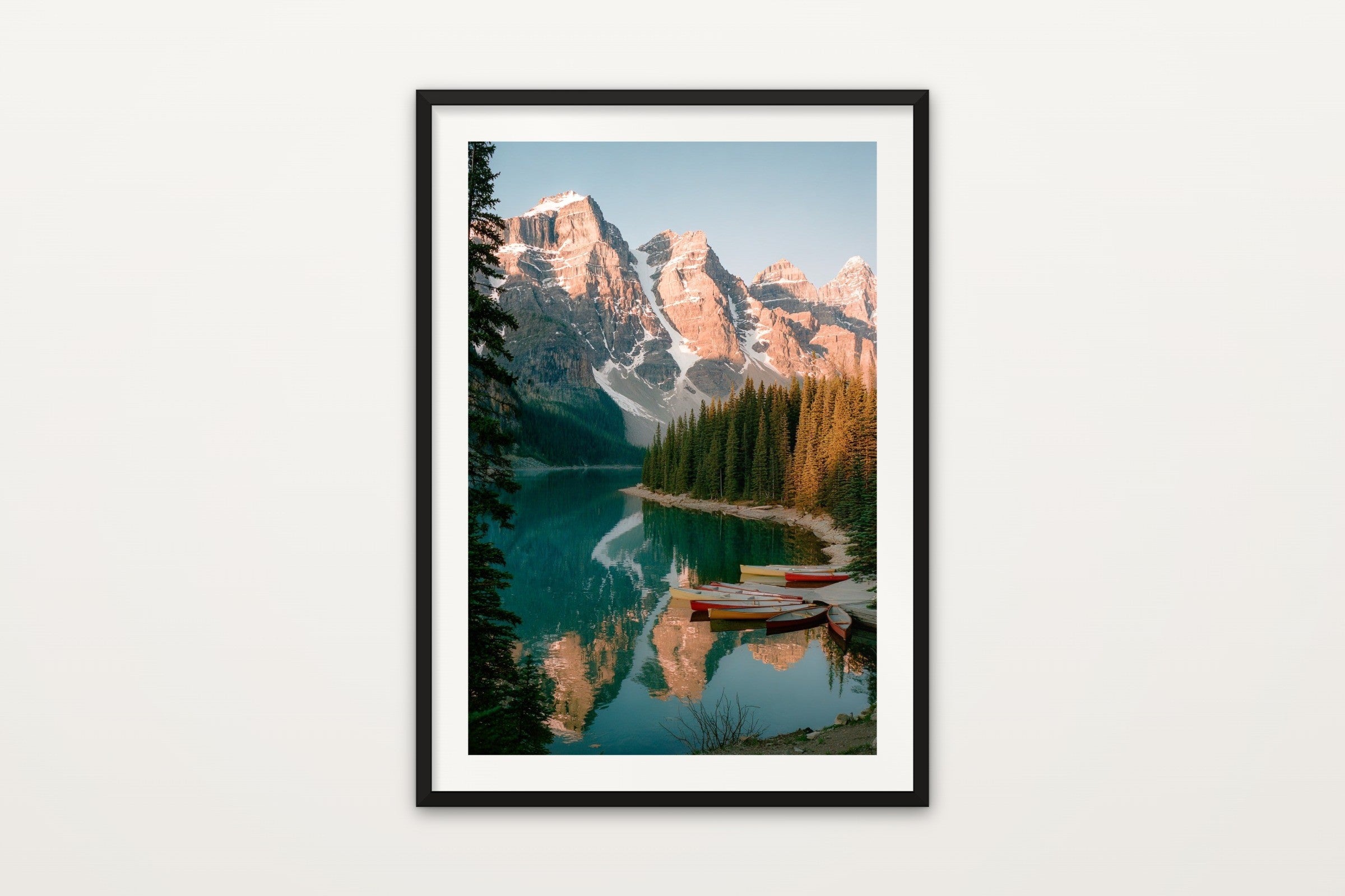 Moraine Lake Canoes wall art print in a black frame