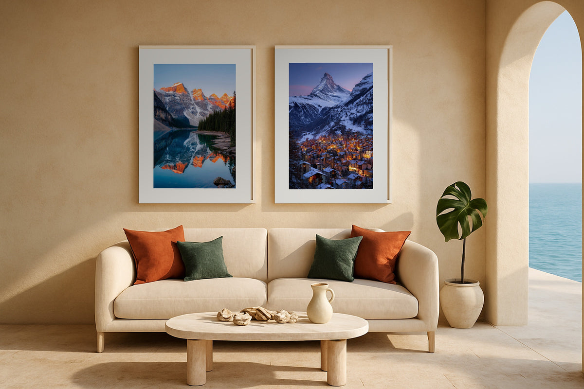 Pair of mountain prints above a sofa: Moraine Lake at Sunrise and Zermatt at Twilight