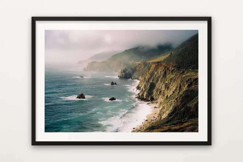Big Sur as a black framed paper print with a white border