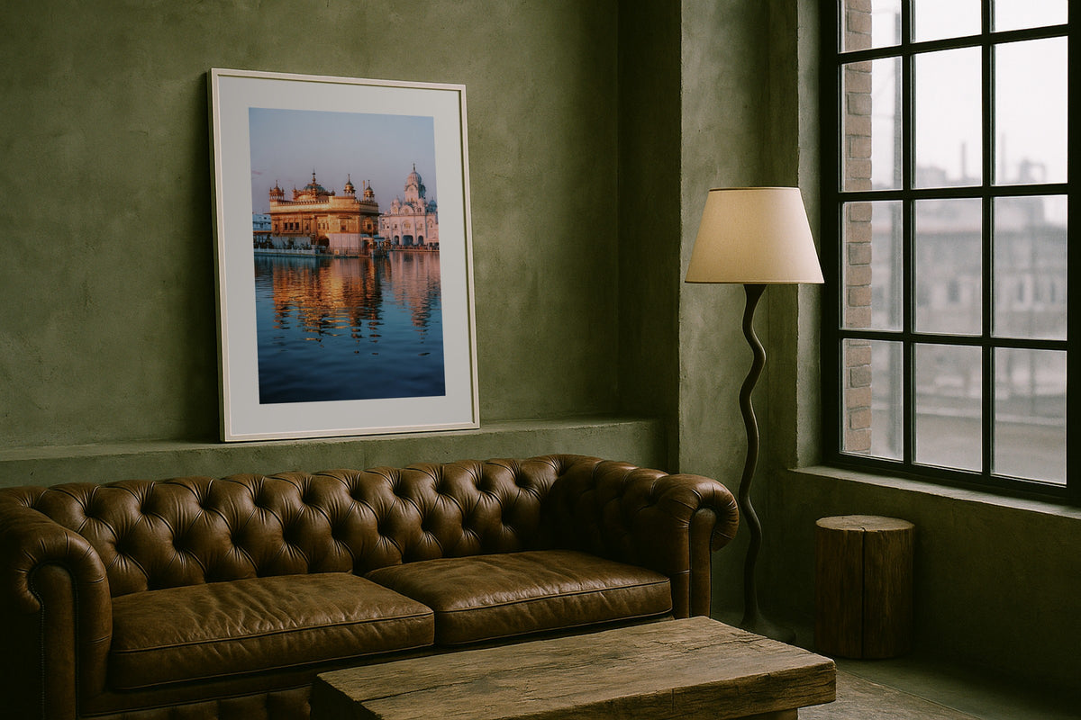 The Golden Temple wall art print, framed with a white border, in a chesterfield loft