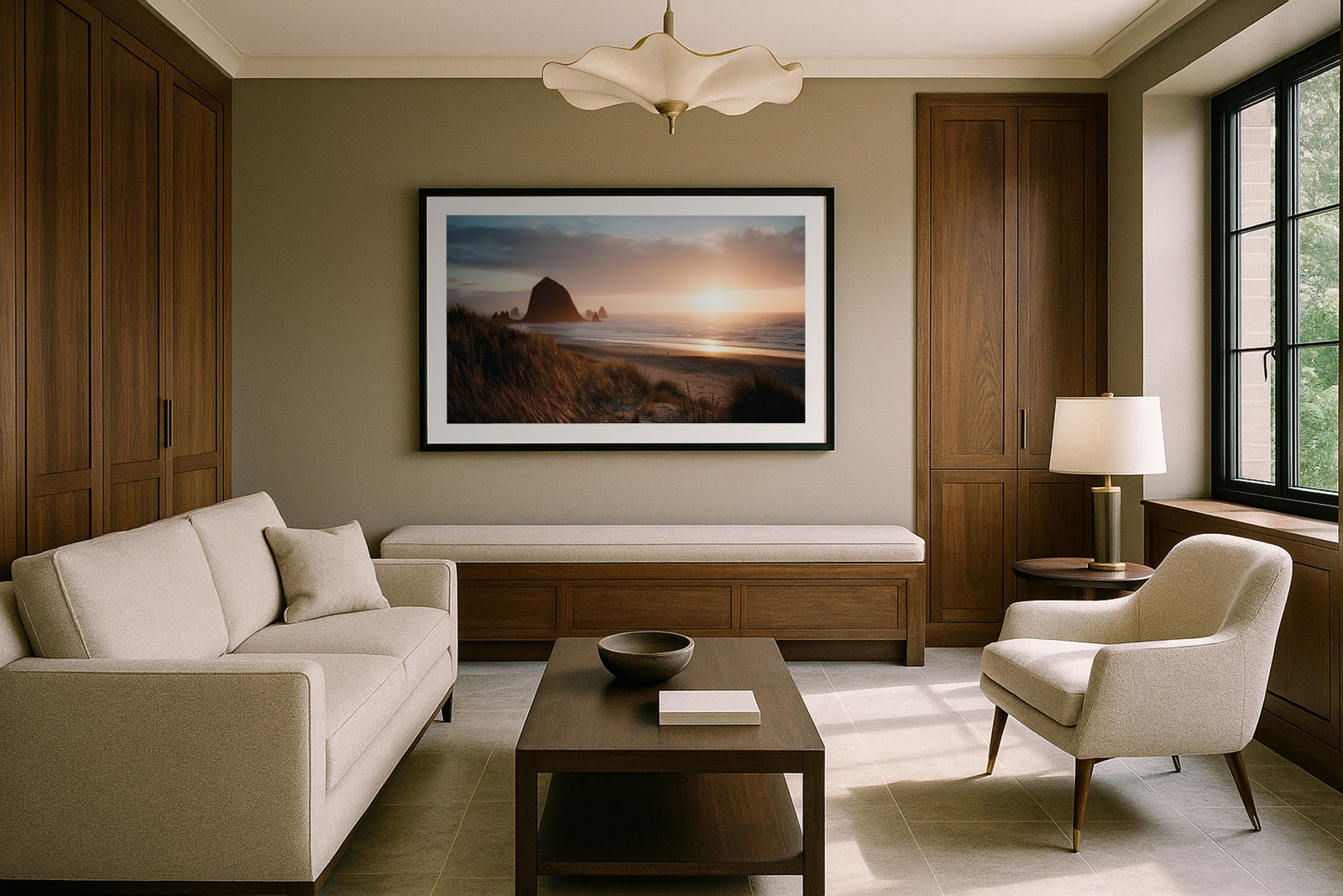 Haystack Rock at Sunset in a black frame above a bench