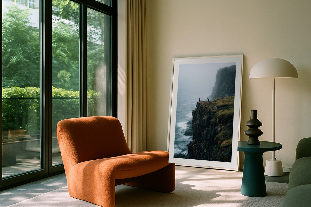 Iceland Puffins II wall art print, framed with a white border, in a leaning garden balcony