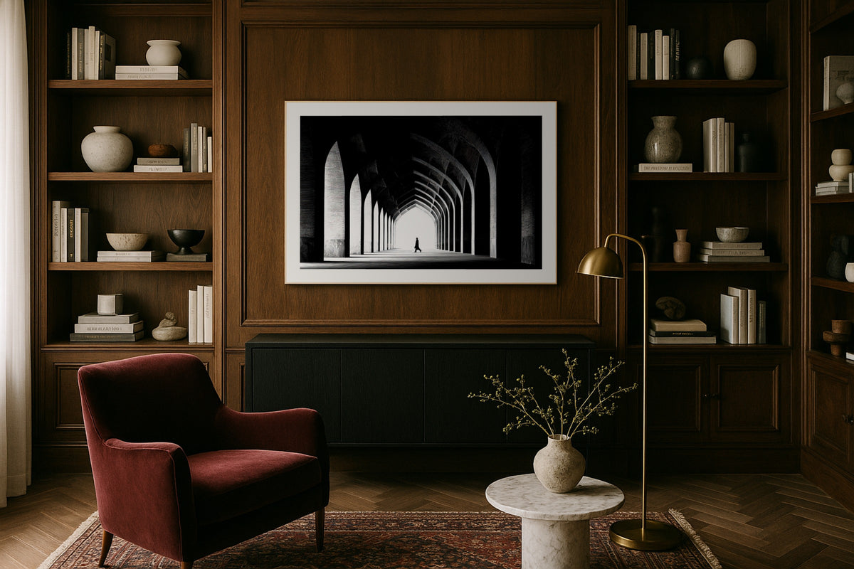 Isfahan Corridor wall art print, framed with a white border, in a library wood panels velvet chair