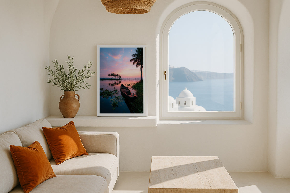 Kerala Boat at Sunset wall art print, framed with a white border, in a Santorini white window