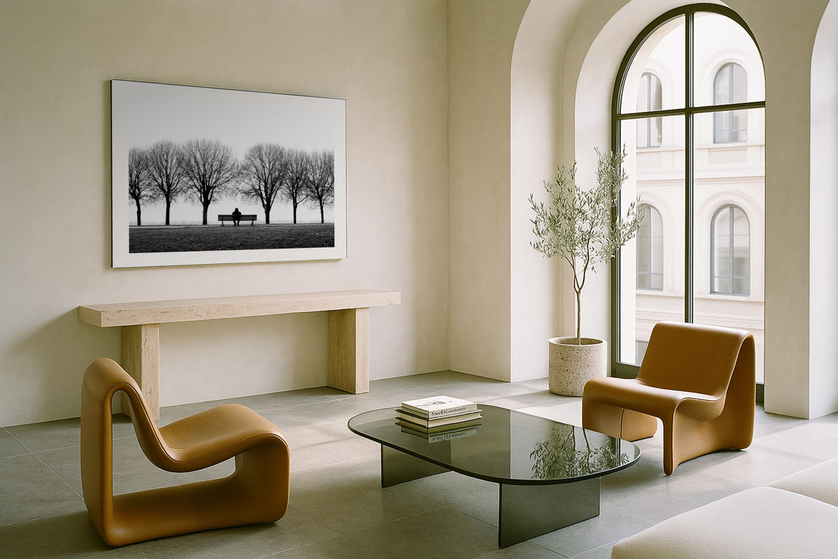Bench Between Trees wall art print, framed with a white border, in a arched room sculptural chairs