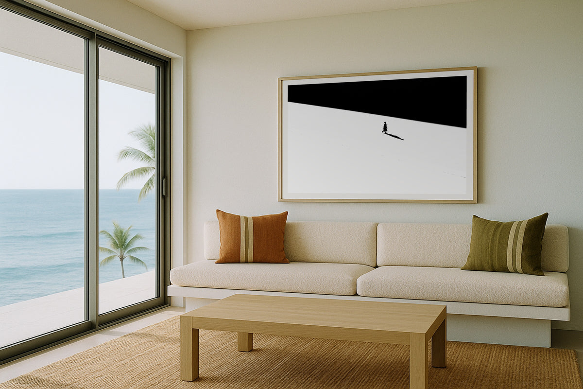 Figure on the Salt Flat wall art print, framed with a white border, in a beach balcony cream sofa