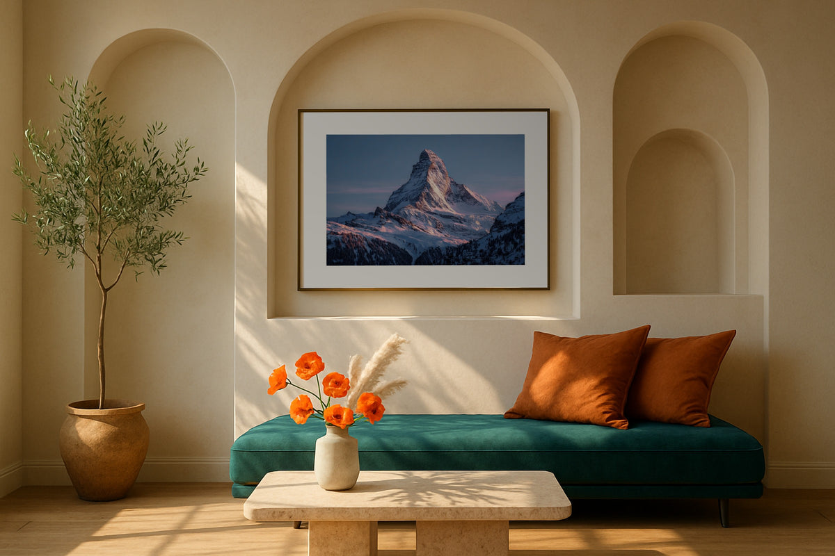 Matterhorn Alpenglow wall art print, framed with a white border, in a leaning on sofa slippers