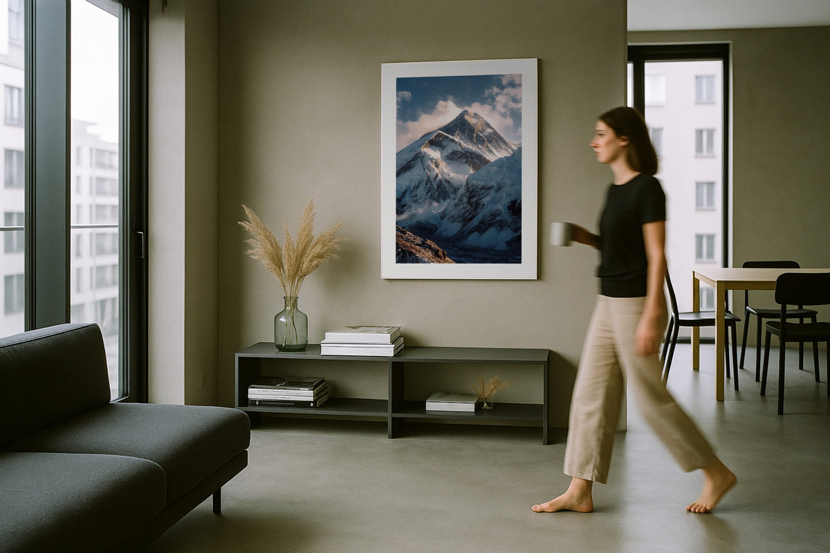 Everest Summit wall art print, framed with a white border, in a arched room sculptural chairs