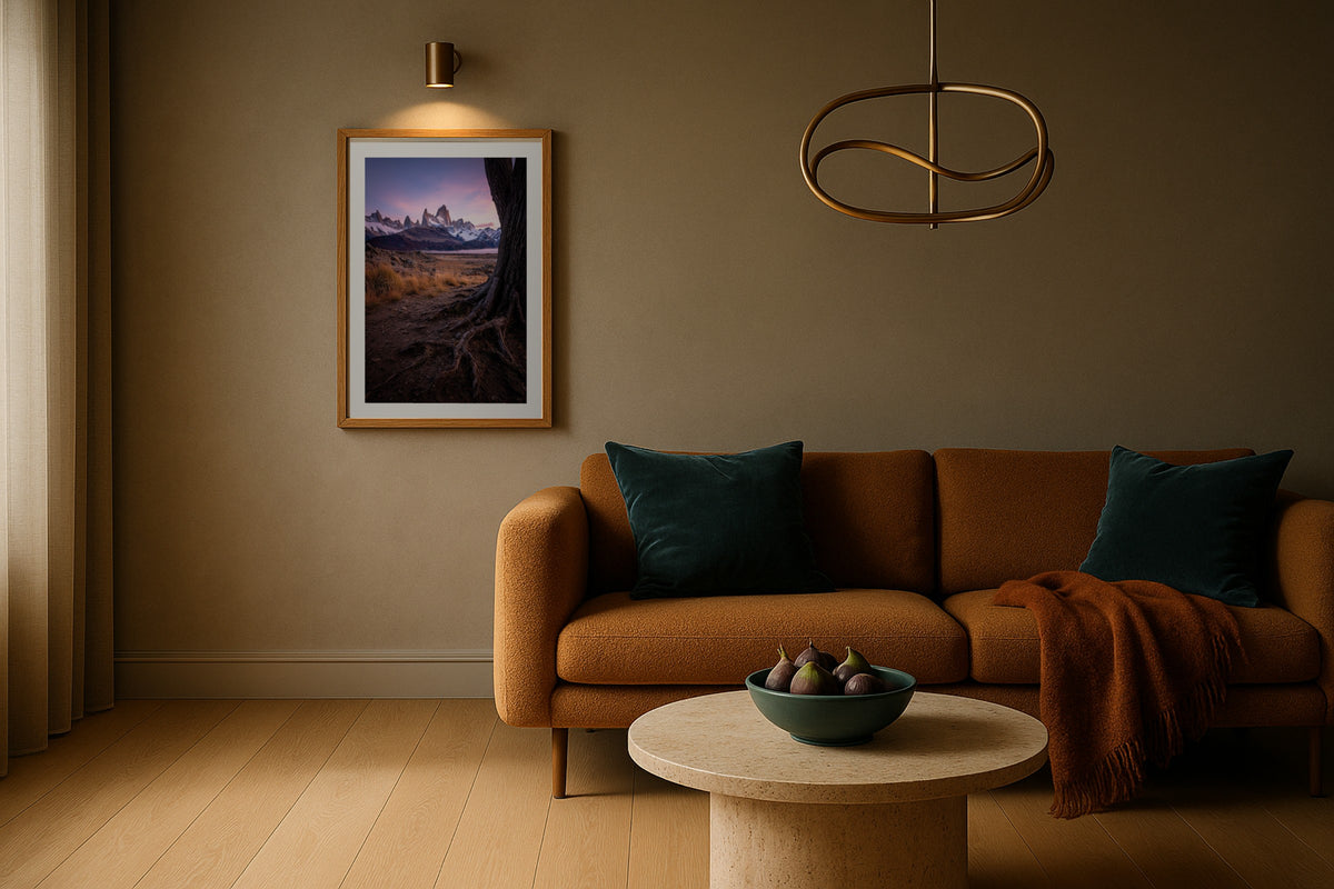 Fitz Roy at Twilight wall art print, framed with a white border, in a hotel bedroom tulips