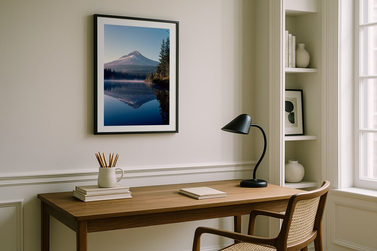 Trillium Lake wall art print, framed with a white border, in a white desk black lamp