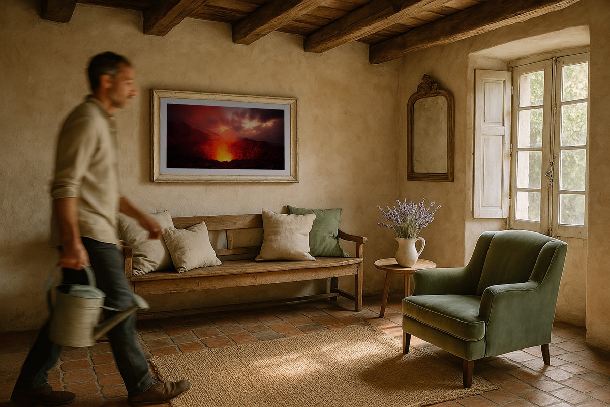 Mount Yasur wall art print, framed with a white border, in a floor magazine leather chair