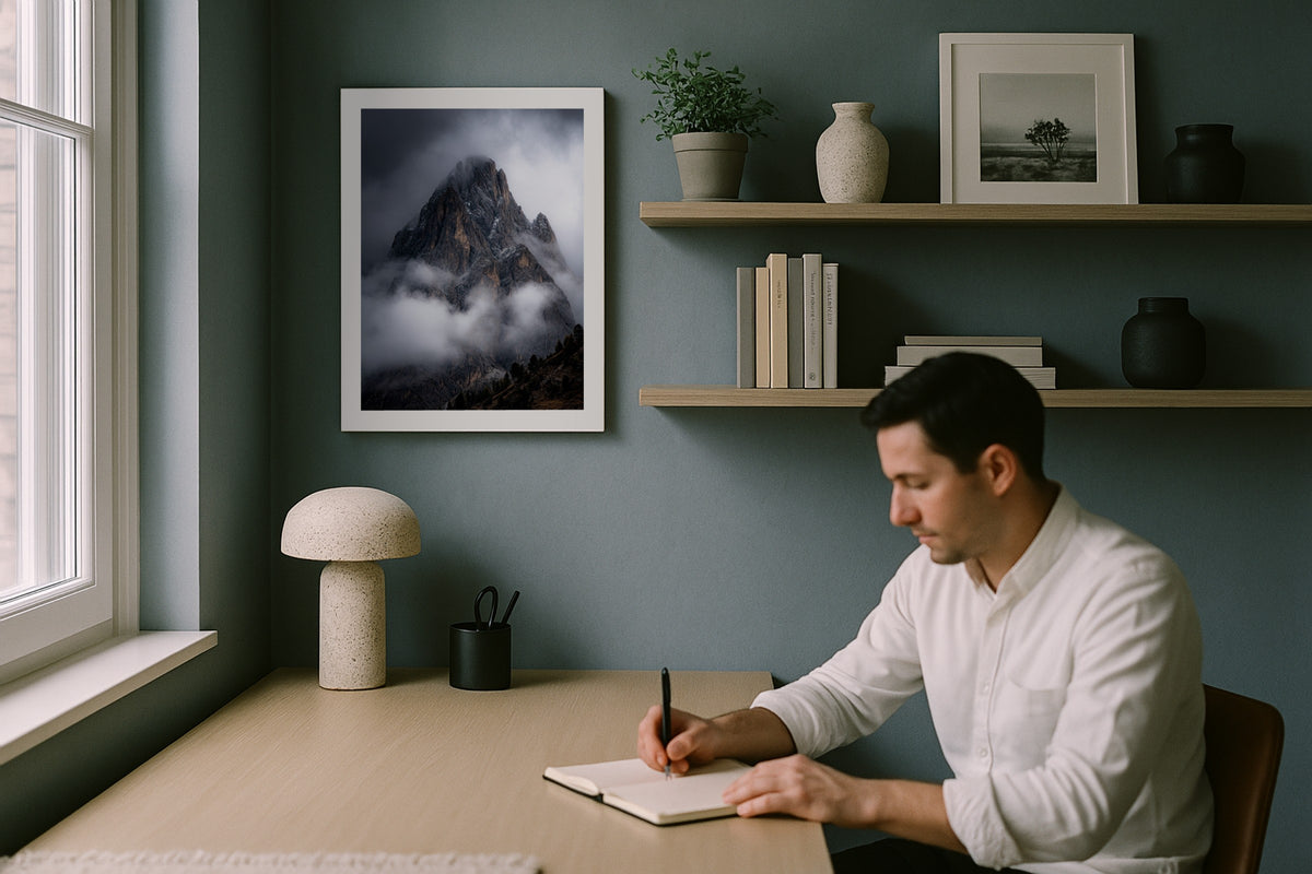 Pale di San Martino wall art print, framed with a white border, in a man writing blue wall