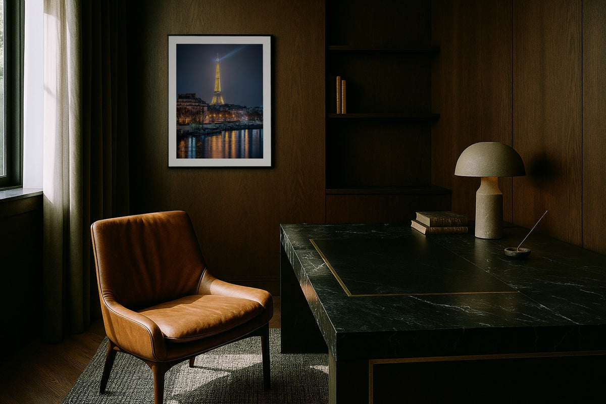 The Seine at Night wall art print, framed with a white border, in a dark city view bedroom