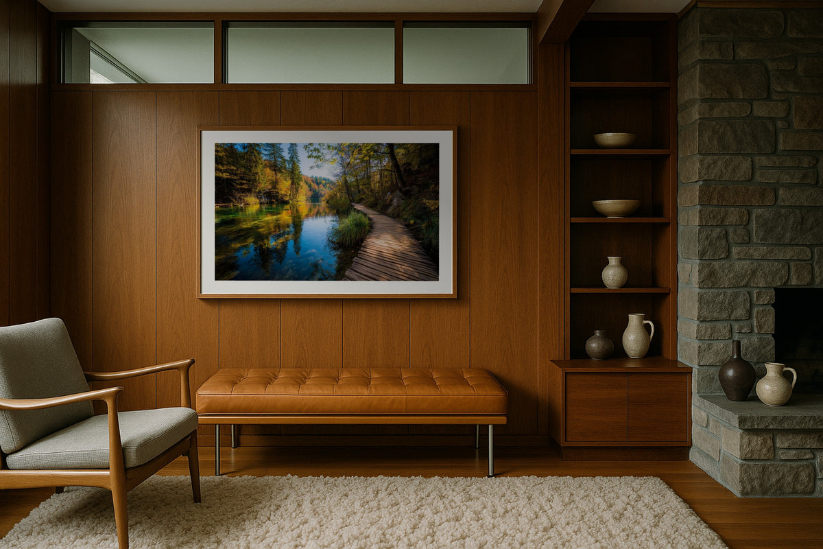 Plitvice Boardwalk wall art print, framed with a white border, in a midcentury stone fireplace