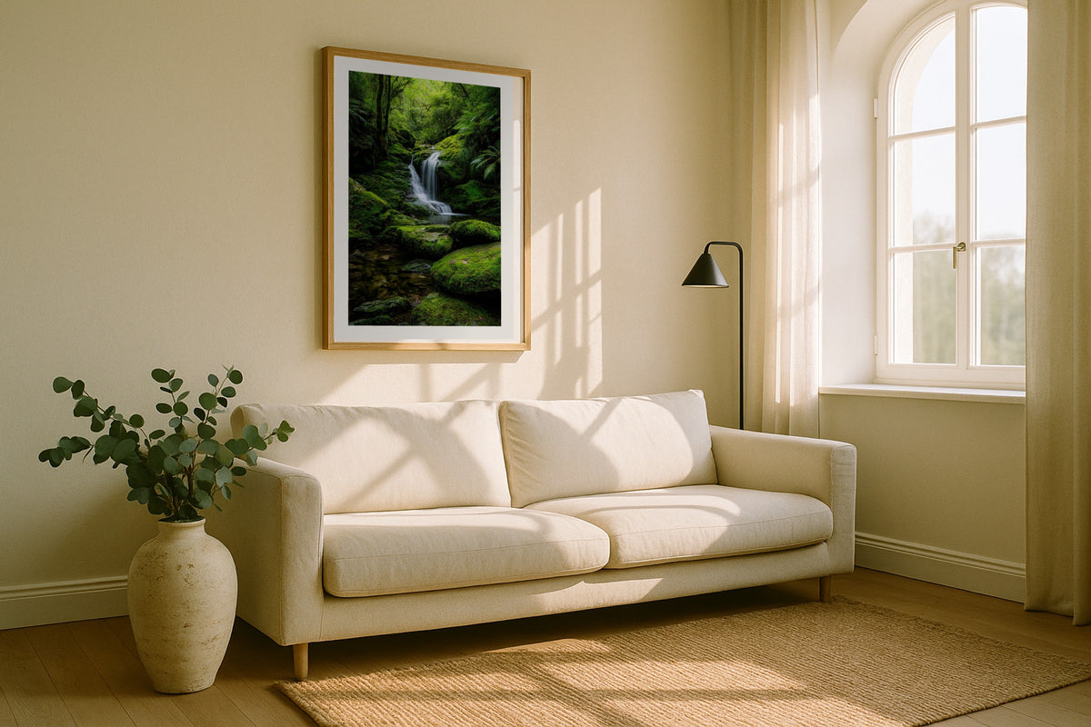 Rainforest Waterfall wall art print, framed with a white border, in a white sofa arched window