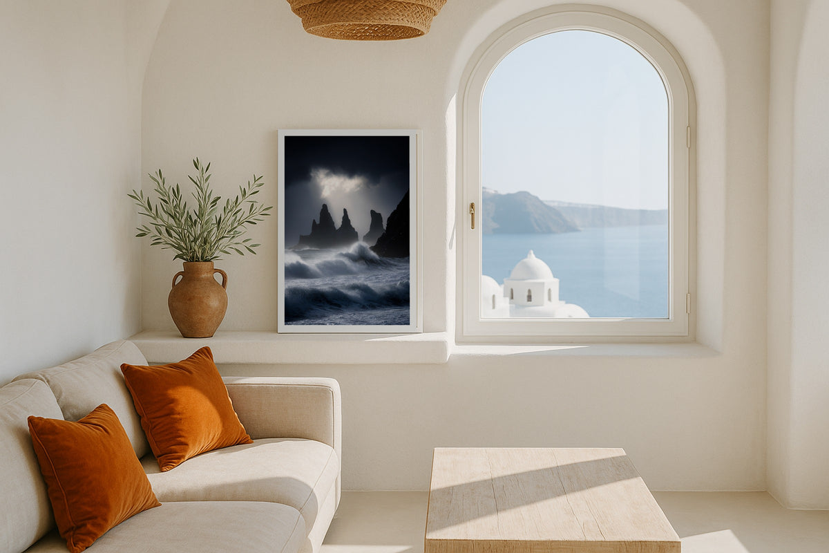 Reynisdrangar wall art print, framed with a white border, in a Santorini white window