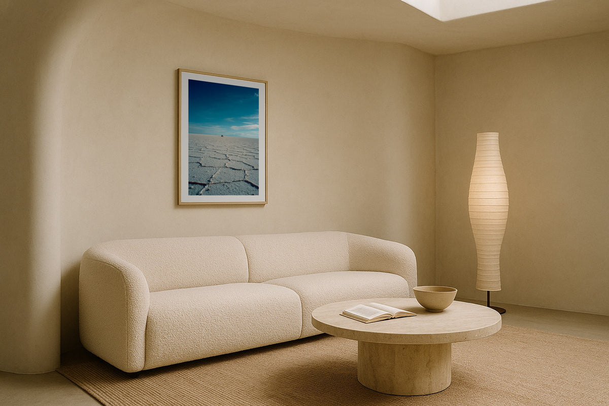 Salar de Uyuni wall art print, framed with a white border, in a cream boucle sofa