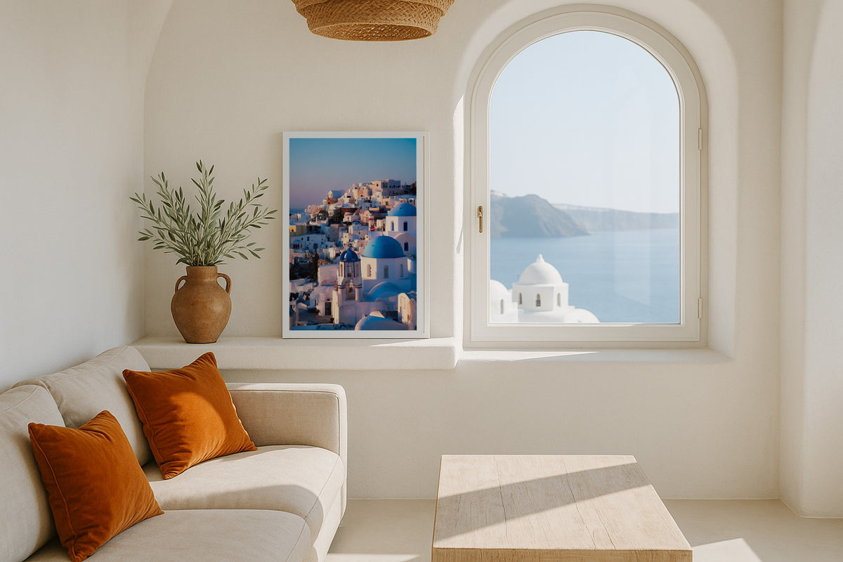 Blue Domes of Oia II wall art print, framed with a white border, in a London windows fireplace