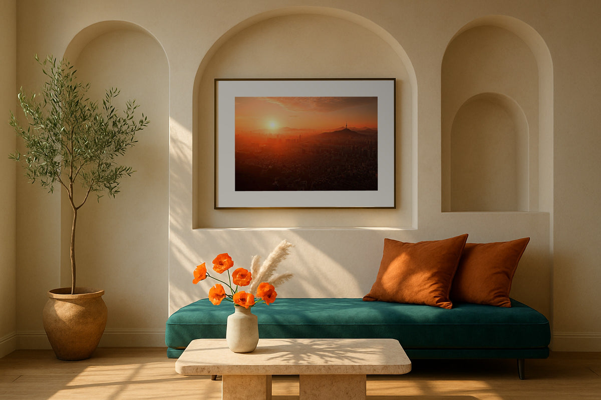 Namsan Tower wall art print, framed with a white border, in a arched niche teal sofa