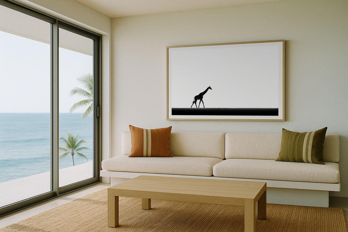 Giraffe on the Horizon wall art print, framed with a white border, in a kids bunk room