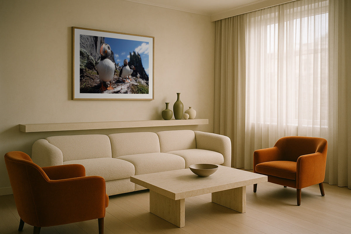 Skellig Puffins wall art print, framed with a white border, in a white coastal fireplace