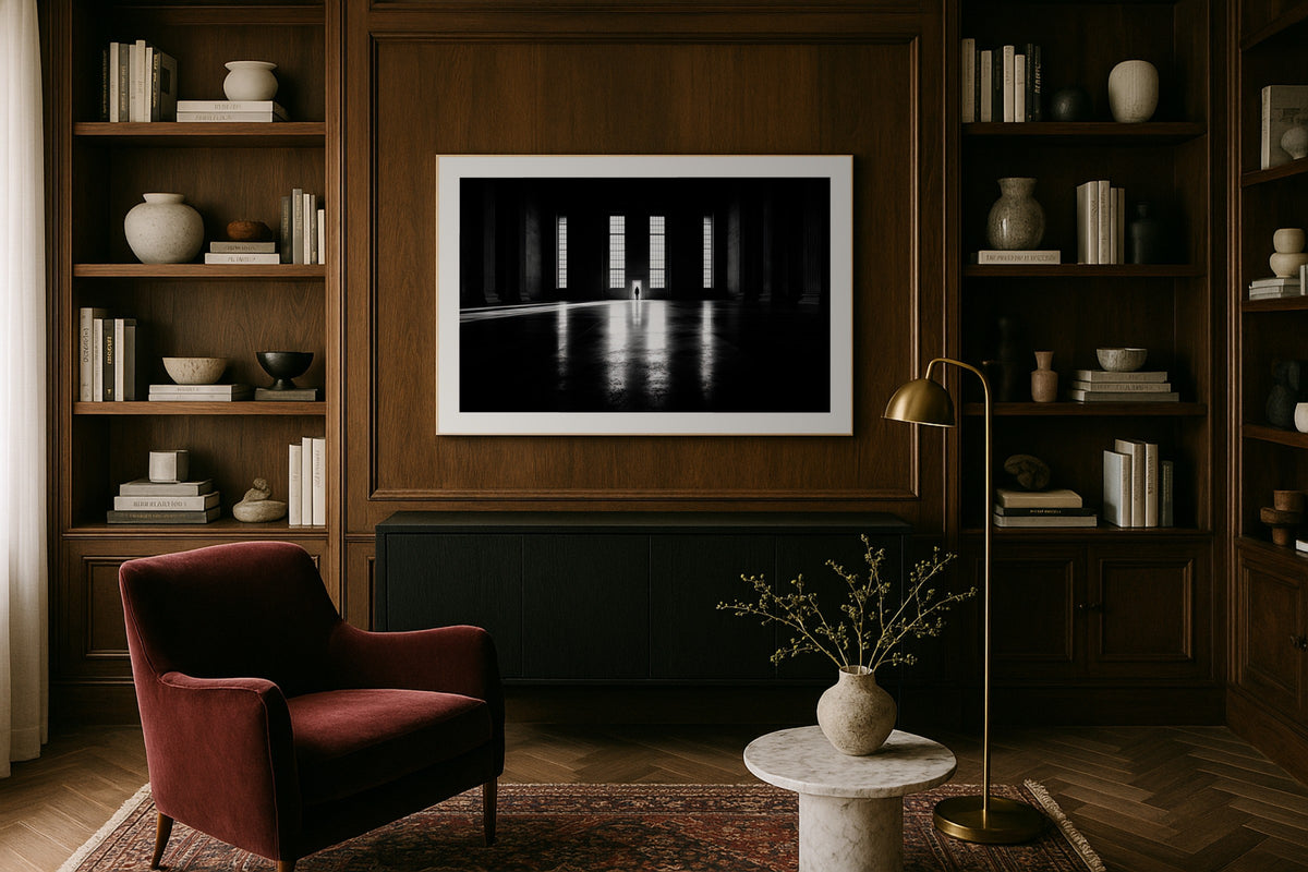 Figure in the Hall wall art print, framed with a white border, in a hotel bedroom wide