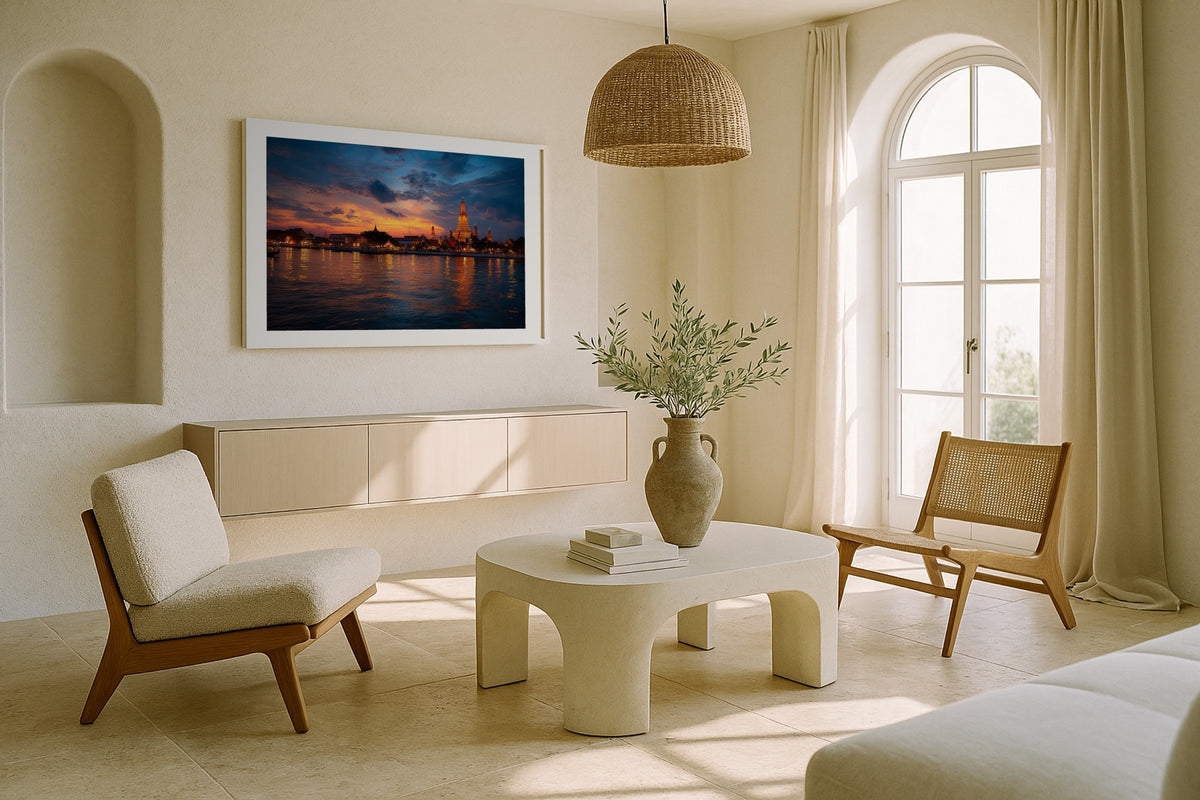 Wat Arun at Sunset wall art print, framed with a white border, in a sunlit cream lounge