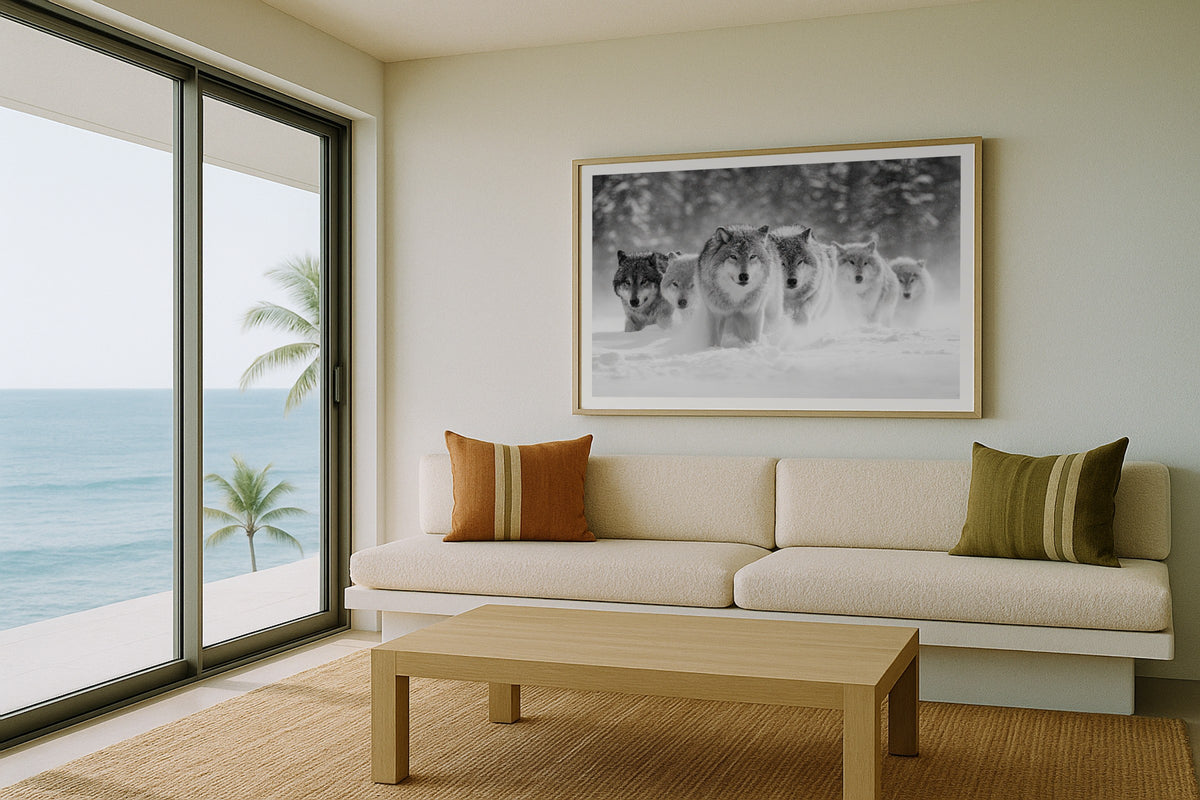Wolf Pack wall art print, framed with a white border, in a Alpine chalet green sofa