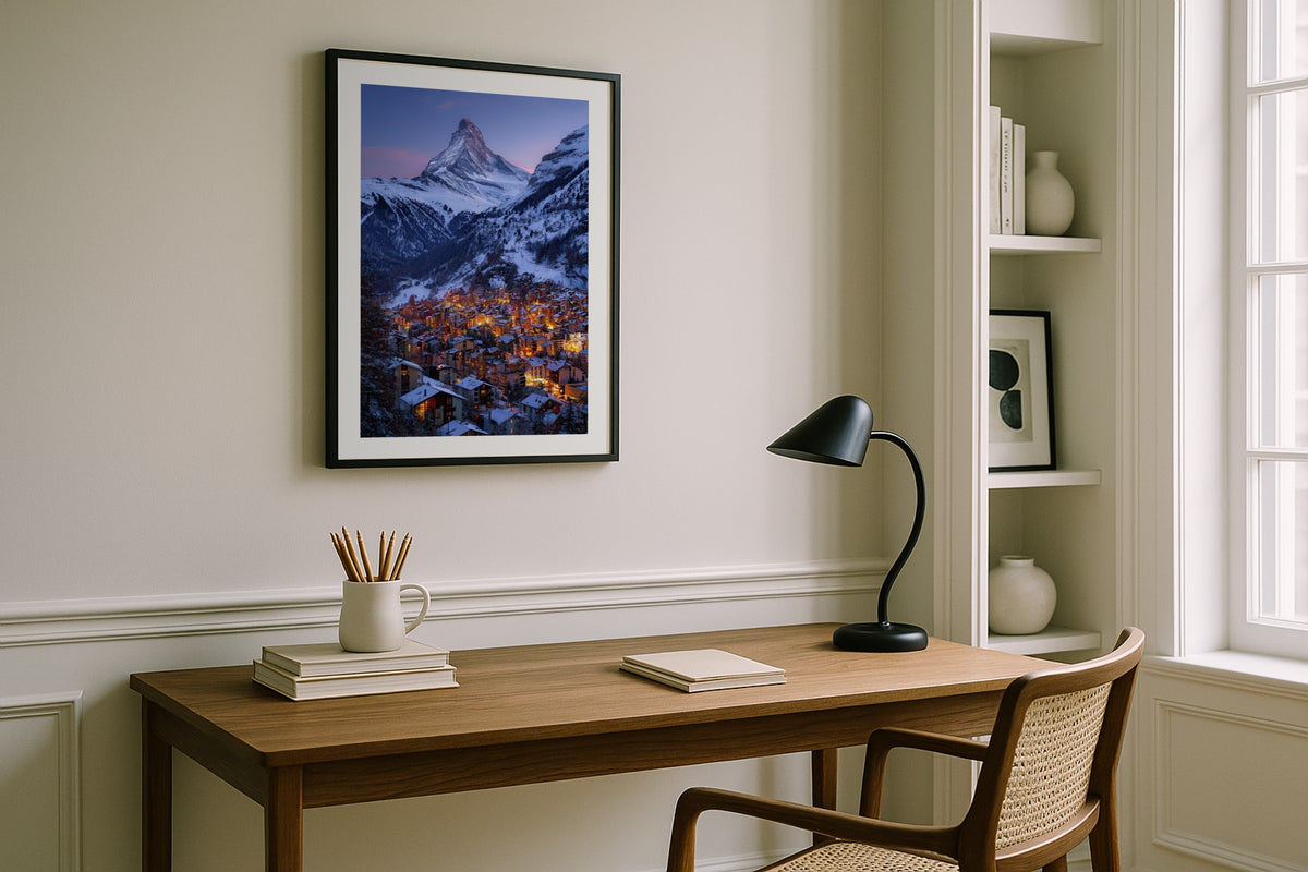 Zermatt at Twilight wall art print, framed with a white border, in a white desk black lamp